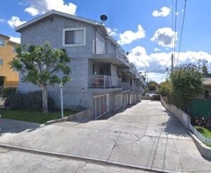 A street view of a building with a sky background