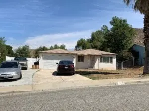 A house with cars parked in front of it